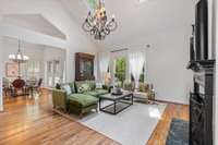 Vaulted ceiling and plenty of windows offer great light for this open living room area.