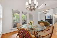 Secondary dining area (could host larger table), adjacent to living room and screened porch.