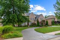 Only home in the neighborhood with a circular driveway! It's so helpful to have the extra parking available. Driveway just power-washed and sealed July 2024