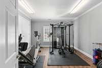 separate hobby room located on basement level-  makes a great  home gym space!