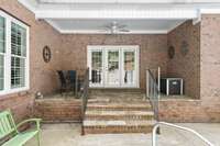 Covered patio offers additional outdoor living space.