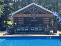 Perfect spot to host a party! This pool structure is built with family time in mind. It has a detached bathroom with changing area. a full outdoor kitchen with fridge & icemaker and an entire side for storing all of your pool equipment.