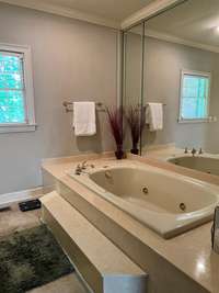 Large jetted jacuzzi tub with quick fill. If you are looking to update consider a 2 person double rain shower in it's place!