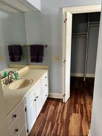 Additional photo of bdrm 4 with large vanity & walk in closet.