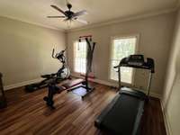 Bdrm 2, currently used as a home gym but has a large closet and can easily be used as a bedroom.