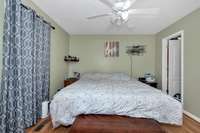 Master Bedroom- laminate flooring, ceiling fan