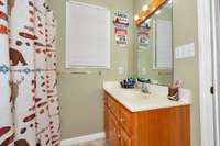 Full bath- Linoleum flooring tub/shower combo