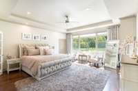 Huge primary bedroom. The floor to ceiling windows really elevate the space.