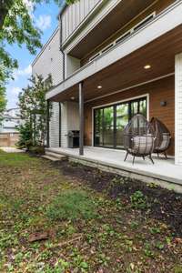 Patio off of the first floor living areas with walkway to DADU and alley access