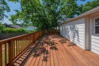 Large newly built & stained deck off across the width of the back of the home.