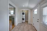 Tucked away laundry area where washer & dryer will remain. Tiled floor for maintenance & ease.