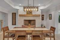 Fireplace with staked stone from floor to ceiling.