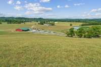 working Cattle Pens and Barn with Cattle working Chutes and 1 of 3 Spring Feed Ponds