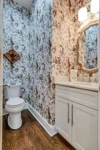 Powder room with  custom wallpaper