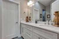 Downstairs owners bath with double vanities