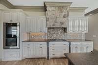 Kitchen has leathered granite.