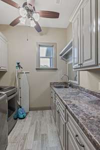 Utility room with lots of storage space and sink