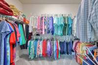 Loads of space for your clothes in this owners closet