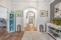 When you enter you are greeted by a large foyer with arched doorways.