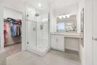 2 vanities, soaker tub, glass frameless shower, and an oversized closet.