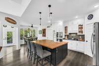 Fantastic hand built center eating area w/ Cabinets underneath and Deep Ceramic Kitchen Sink along with the butcher block counter..