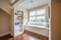 Window seat overlooking view.  Bookcase with hidden room behind it.