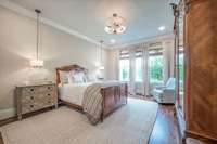 Master Bedroom with hanging chandeliers at bedside tables