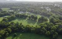 View from above shows Pinkerton Park behind the pasture. With Downtown Franklin Beyond