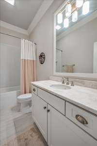 Guest Bath, tiled shower ceramic tile floors, Limestone countertop