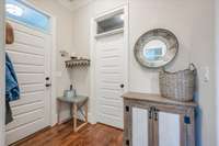 Mud Room, entrance to garage and Powder Rm