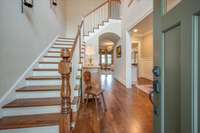 Front door opens to a 2 story Foyer and Grand Staircase, Barrel Ceiling to Great Room