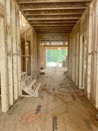 Two-story foyer with spacious vestibule. *this home is under construction  Photo Taken 8/14/24