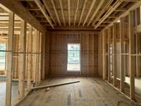 Main Level Guest Bedroom with ensuite *this home is under construction  Photo Taken 8/14/24