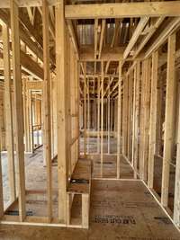 Bath #4 walk-in shower with a bench.  *this home is under construction  Photo Taken 8/15/24