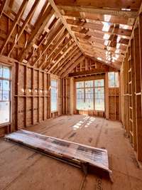 Primary Bedroom on main level with vaulted ceiling. *this home is under construction  Photo Taken 8/14/24