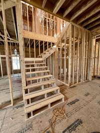 View of staircase that opens to below. *this home is under construction  Photo Taken 8/14/24