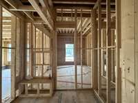 View of spacious guest Bath and walk-in closet. *this home is under construction  Photo Taken 8/14/24