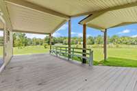 The massive covered back porch offers a perfect retreat with its stunning views of the surrounding landscape. 787 Finnie Simmons Rd  Woodbury, TN  37190