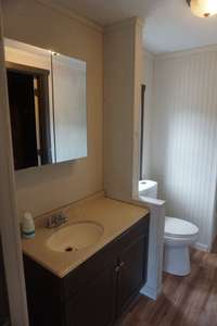 Bathroom 2 is equipped with a single vanity and a combination shower and tub. 787 Finnie Simmons Rd  Woodbury, TN  37190