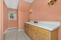 2nd story- full bath- tub/shower combo, tile flooring and vanity