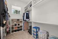 Wood shelving in this walk in closet!