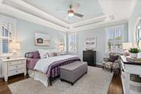 Primary on the main with trey ceiling, plantation shutters, real wood floors...