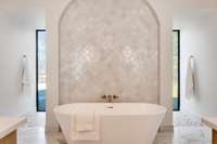 What a stunning stand alone tub in the primary bathroom!