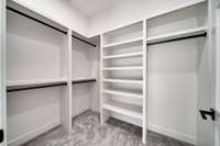 Huge walk in closet with all of the storage you could need.