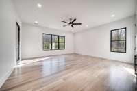 Spacious room with a door to the back patio.