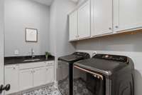 Laundry Room with Cabinets and Sink