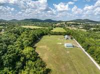 The farm is cleared and fenced/crossfenced with barn / barndominium on 11.21 acres.