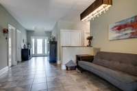 Open living area with ceramic tile flooring.