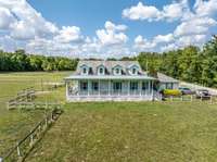 2290 Osborn Rd, Arrington, TN.  Wrap around porch and 4 gable, roof design, set off this 3 BR/ 2 BA single level home.