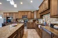 There is so much wonderful granite counterspace in this kitchen. Could be great for entertaining!